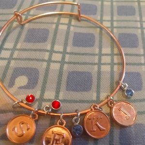 Initial bracelets with gem charms
